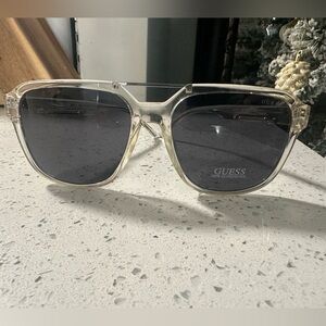 GUESS Transparent Frame Sunglasses with Dark Lenses. 100% uv protection